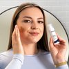Photo of a woman applying the product.