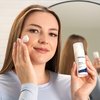 Photo of a woman applying the product.