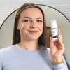 Photo of a woman applying the product.