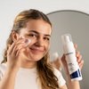Photo of a woman applying the product.