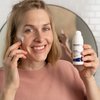 Photo of a woman applying the product.